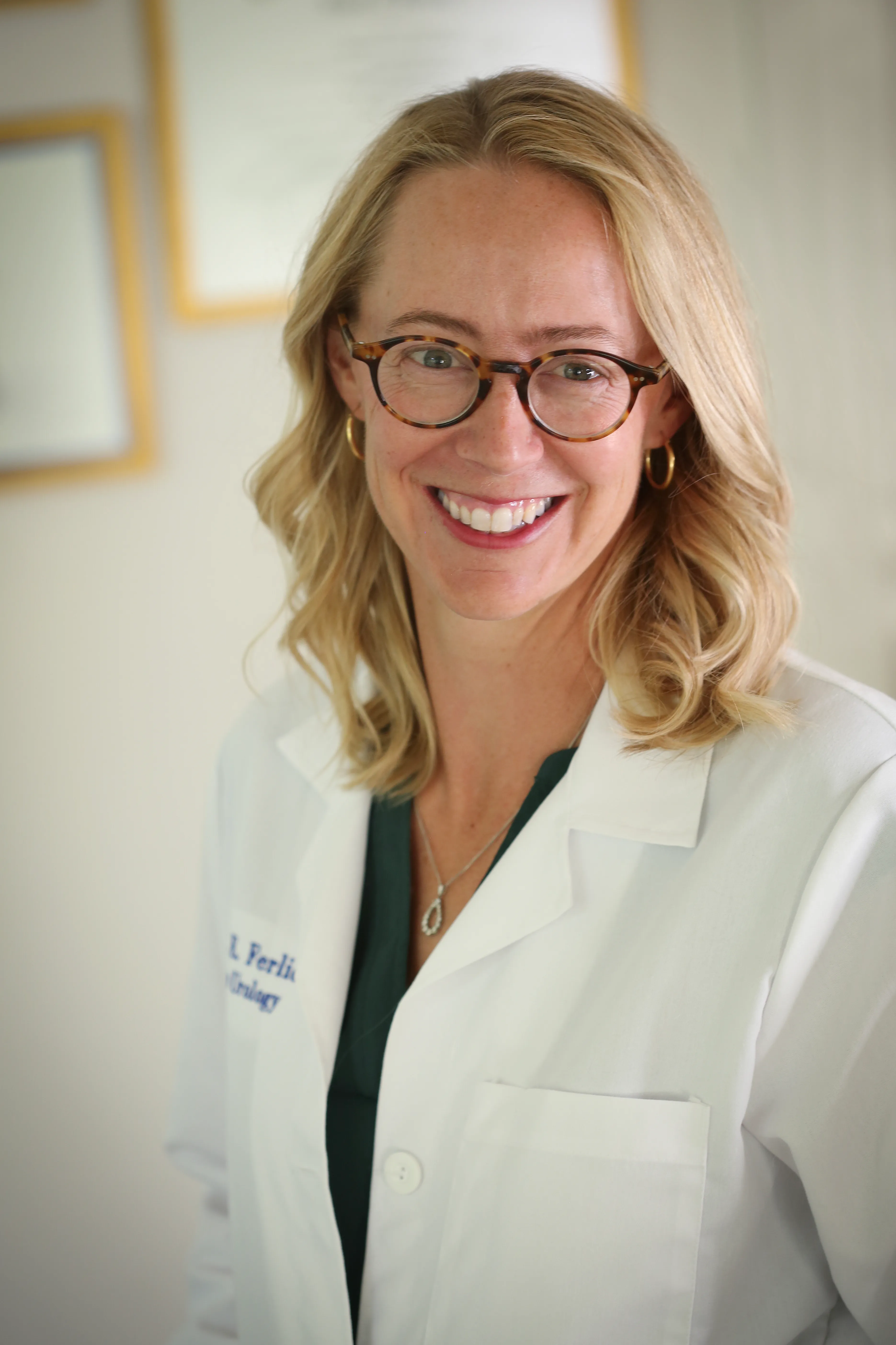 Elisabeth Ferlic, MD, in her white coat